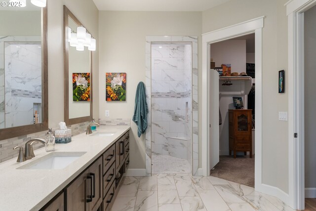 bathroom with tasteful backsplash, vanity, and a shower