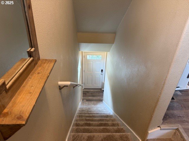9575 SW Tephra Ter, Beaverton, OR 97007 - stairway featuring baseboards, a textured wall, and wood finished floors