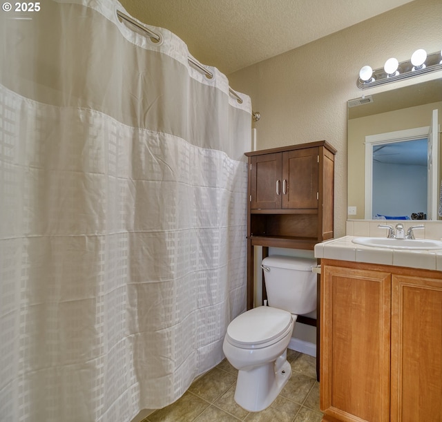 9575 SW Tephra Ter, Beaverton, OR 97007 - full bath featuring toilet, tile patterned flooring, vanity, and a shower with shower curtain
