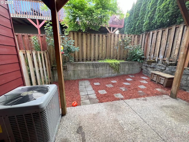 view of patio featuring central AC unit and a fenced backyard