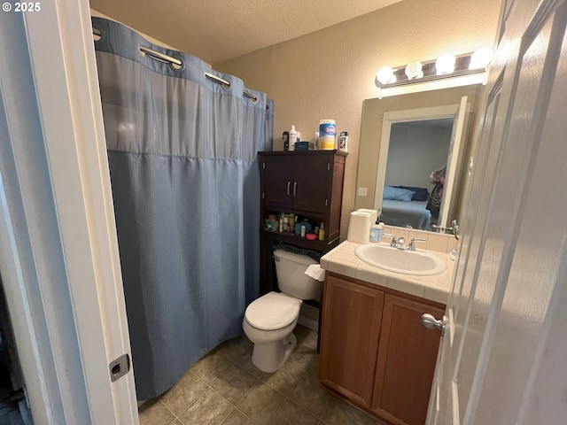 full bath with vanity, tile patterned flooring, toilet, ensuite bathroom, and a shower with shower curtain