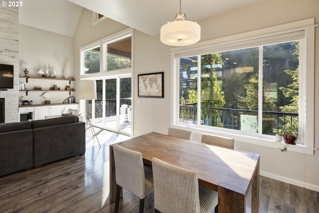 21420 NE Red Hills Ln, Dundee, OR 97115 - dining space featuring healthy amount of natural light, wood finished floors, lofted ceiling, and a fireplace