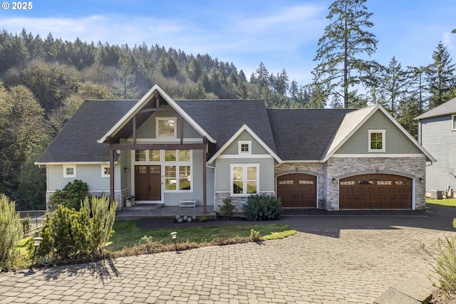 21420 NE Red Hills Ln, Dundee, OR 97115 - view of front facade with stone siding, decorative driveway, and a garage