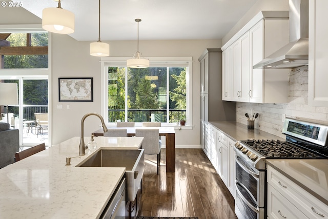 21420 NE Red Hills Ln, Dundee, OR 97115 - kitchen with range with two ovens, wall chimney range hood, dark wood-style flooring, and healthy amount of natural light
