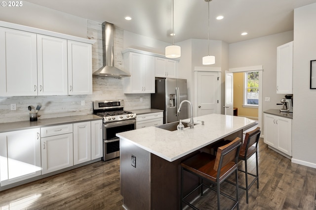 21420 NE Red Hills Ln, Dundee, OR 97115 - kitchen featuring wall chimney range hood, appliances with stainless steel finishes, dark wood-type flooring, tasteful backsplash, and recessed lighting