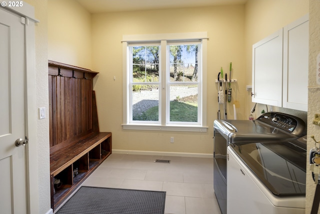 21420 NE Red Hills Ln, Dundee, OR 97115 - washroom with cabinet space, washing machine and dryer, and light tile patterned floors
