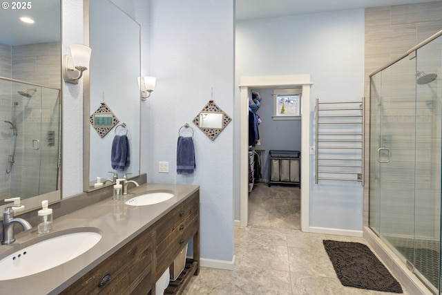21420 NE Red Hills Ln, Dundee, OR 97115 - bathroom featuring a shower stall, double vanity, a spacious closet, tile patterned floors, and radiator heating unit