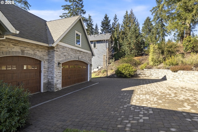 21420 NE Red Hills Ln, Dundee, OR 97115 - view of property exterior with stone siding, driveway, and a shingled roof