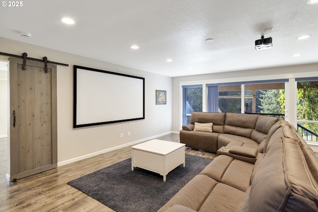 21420 NE Red Hills Ln, Dundee, OR 97115 - cinema room with healthy amount of natural light, wood finished floors, recessed lighting, and a barn door