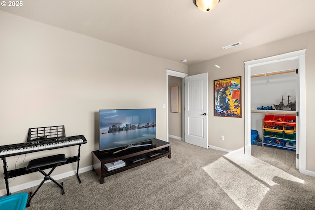 living area with carpet floors, visible vents, and baseboards