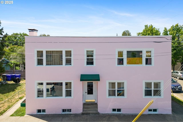 3905 SE 54th Ave, Portland, OR 97206 - townhome / multi-family property with a chimney and fence