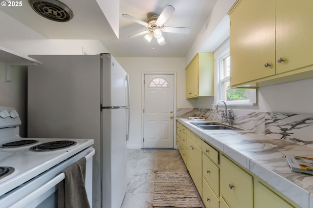 3905 SE 54th Ave, Portland, OR 97206 - kitchen featuring white range with electric cooktop, a sink, light countertops, light marble finish floors, and ceiling fan