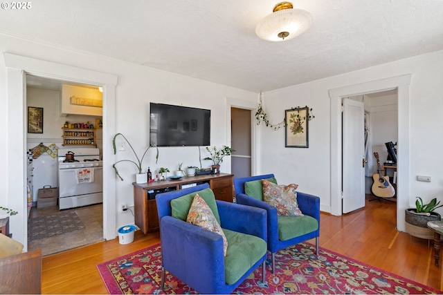 3905 SE 54th Ave, Portland, OR 97206 - living area featuring wood finished floors and crown molding