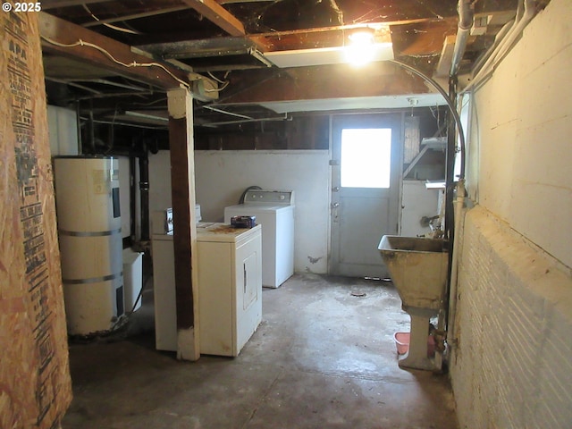 328 6th Ave, Seaside, OR 97138 - basement featuring washer and dryer and secured water heater