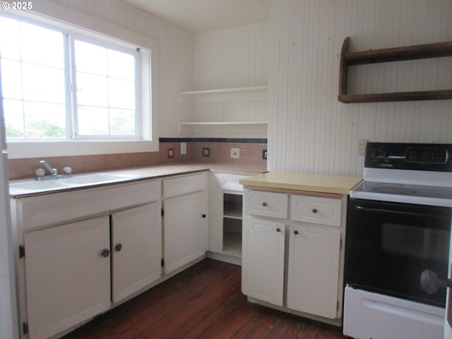 328 6th Ave, Seaside, OR 97138 - kitchen featuring range with electric stovetop, open shelves, dark wood-style floors, and light countertops
