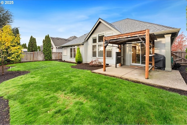 back of house with a pergola, a yard, and a patio