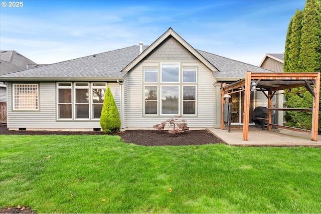 back of property with a patio, a pergola, and a lawn