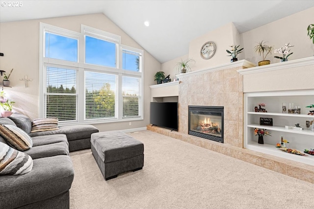 living room with a fireplace, light colored carpet, and built in features