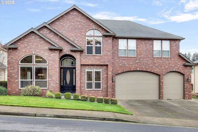 view of front of house featuring a garage and a front lawn