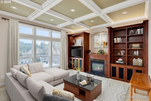 living room featuring beamed ceiling, ornamental molding, and coffered ceiling