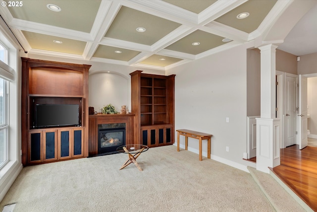 carpeted living room with beamed ceiling, ornate columns, ornamental molding, and coffered ceiling