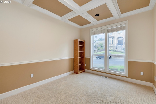 empty room with beam ceiling, crown molding, light carpet, and coffered ceiling