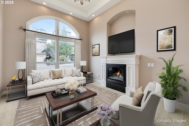 living room featuring a high ceiling