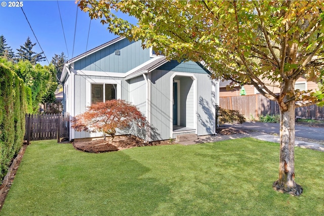 view of outbuilding with fence