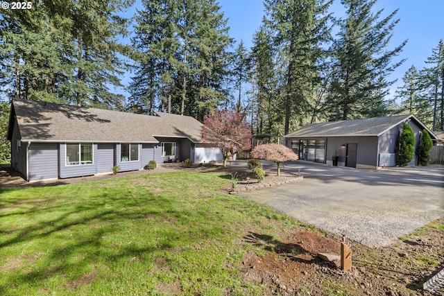 27650 SW Canyon Creek Rd, Wilsonville, OR 97070 - rear view of house with a lawn and roof with shingles