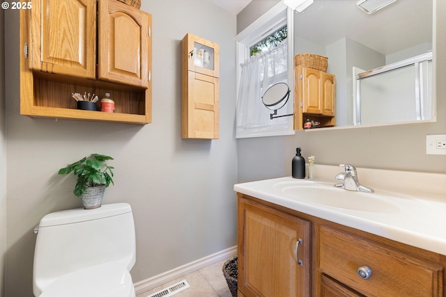 27650 SW Canyon Creek Rd, Wilsonville, OR 97070 - bathroom with baseboards, vanity, toilet, a shower with shower door, and tile patterned flooring