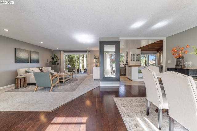 27650 SW Canyon Creek Rd, Wilsonville, OR 97070 - living room with dark wood finished floors, a textured ceiling, recessed lighting, and baseboards