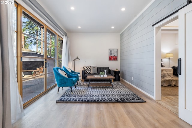 27650 SW Canyon Creek Rd, Wilsonville, OR 97070 - sitting room featuring wooden walls, wood finished floors, recessed lighting, ornamental molding, and baseboards