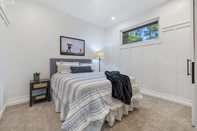 27650 SW Canyon Creek Rd, Wilsonville, OR 97070 - bedroom with light colored carpet, a decorative wall, and recessed lighting