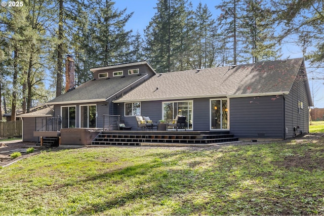 27650 SW Canyon Creek Rd, Wilsonville, OR 97070 - back of house with a lawn, a deck, a chimney, and a shingled roof