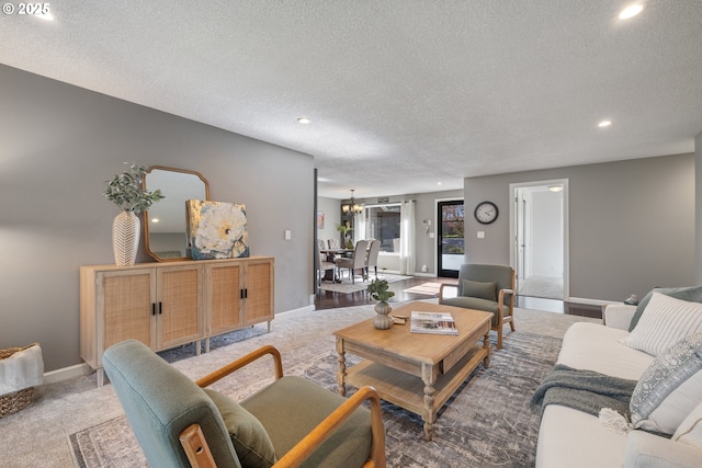 27650 SW Canyon Creek Rd, Wilsonville, OR 97070 - living area featuring a textured ceiling, recessed lighting, carpet, and baseboards