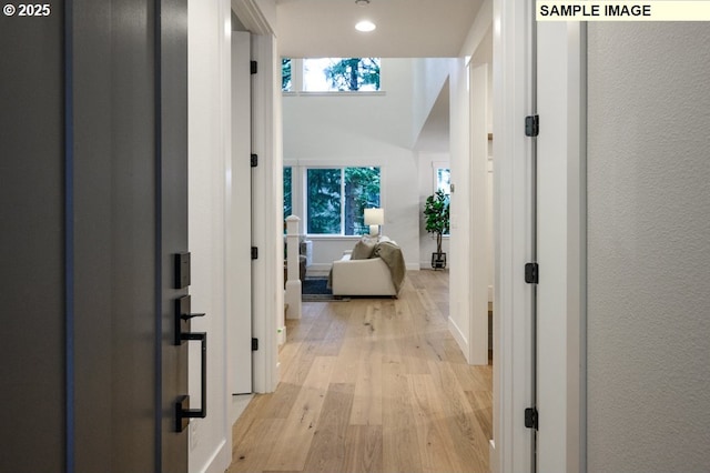 corridor featuring light hardwood / wood-style floors