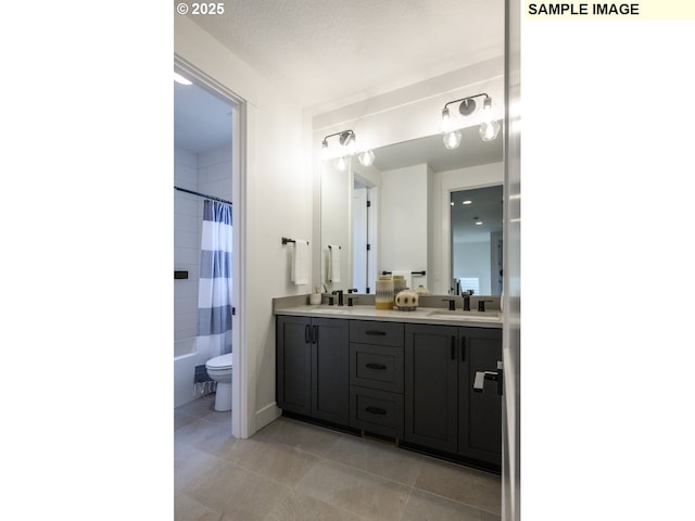 full bathroom featuring toilet, a textured ceiling, vanity, shower / bath combo, and tile patterned flooring