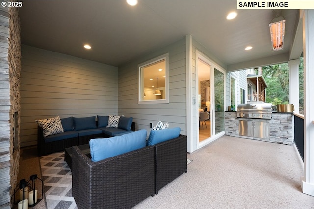 view of patio / terrace featuring a grill, outdoor lounge area, and an outdoor kitchen