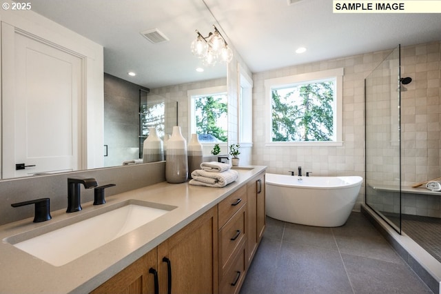 2285 Satter St, West Linn, OR 97068 - full bath with a shower stall, tile walls, tile patterned floors, a soaking tub, and double vanity