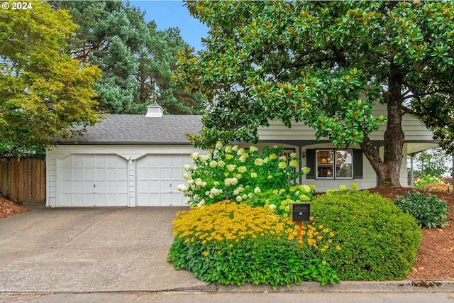 view of front of property with a garage