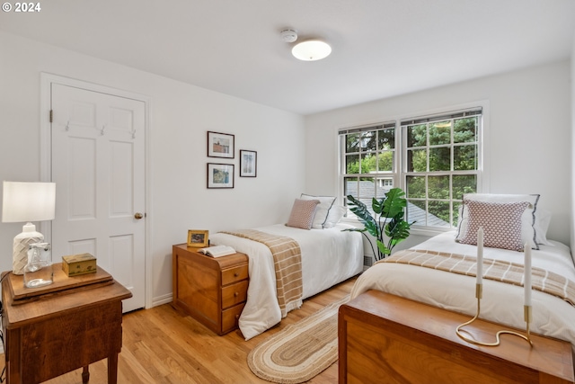 bedroom with light wood-type flooring