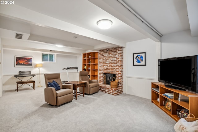 living room with a wood stove and carpet flooring