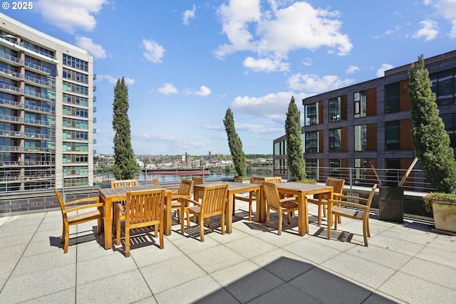 view of patio / terrace featuring a water view and outdoor dining area