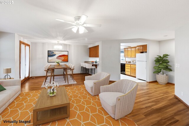 2744 Dayna Ln, Eugene, OR 97408 - living area with light wood-type flooring, ceiling fan, and baseboards