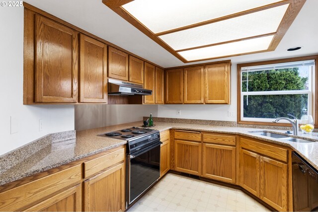 2744 Dayna Ln, Eugene, OR 97408 - kitchen featuring black appliances, under cabinet range hood, a sink, light flooring, and brown cabinetry