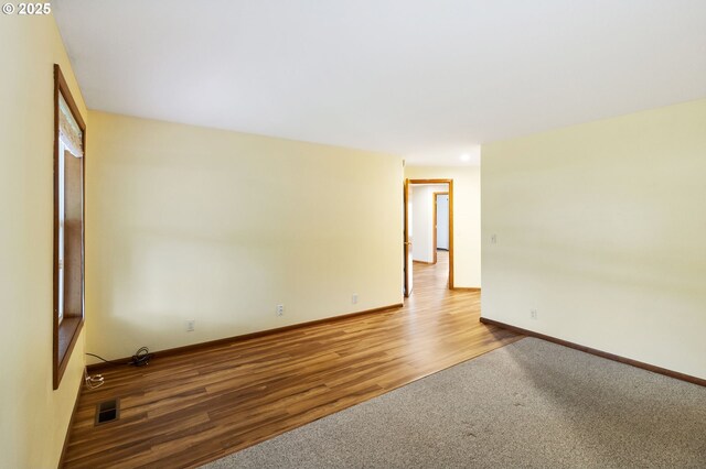 2744 Dayna Ln, Eugene, OR 97408 - carpeted spare room with wood finished floors and baseboards