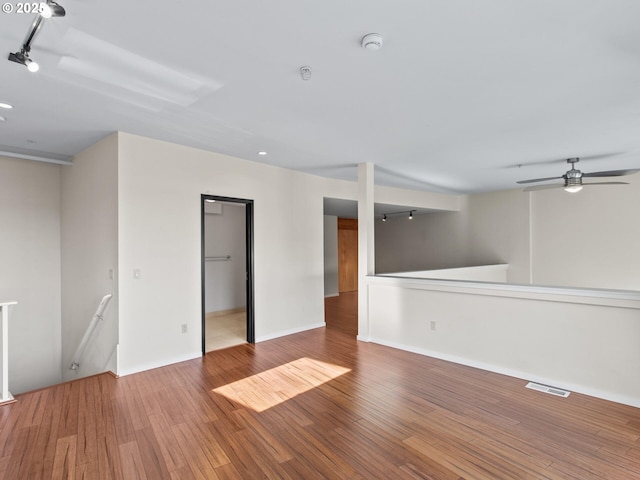 unfurnished room featuring hardwood / wood-style flooring and ceiling fan