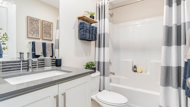 full bathroom featuring vanity, shower / bathtub combination with curtain, and toilet