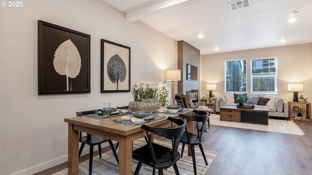 dining room with visible vents, wood finished floors, baseboards, beamed ceiling, and recessed lighting