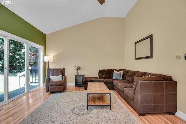 1223 NE 160th Ave, Portland, OR 97230 - living room featuring a ceiling fan, baseboards, wood finished floors, and high vaulted ceiling
